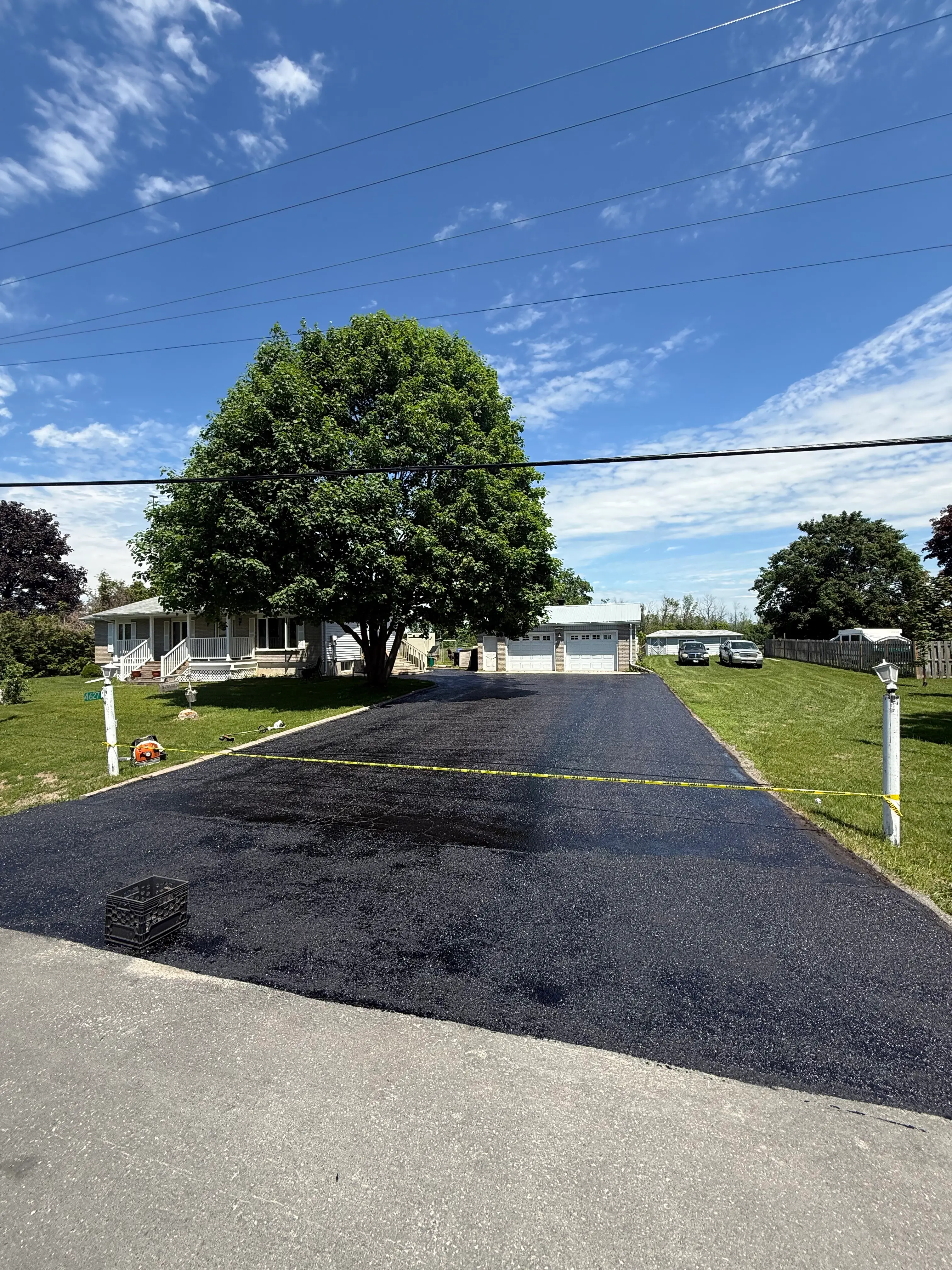 After driveway sealing at a residential driveway in Orillia,